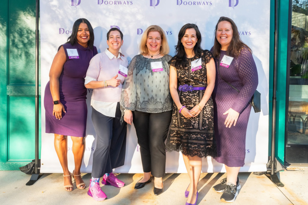 Members of Doorways' leadership team pose together at annual Open Hearts, Open Doors fundraising event
